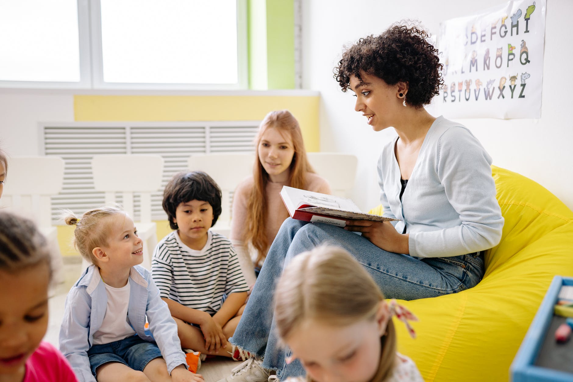 Teacher reading to her schoolchildren